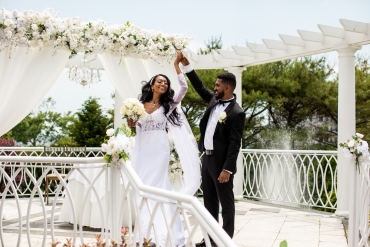 beautiful bride dancing with groom on outdoor ceremony steps