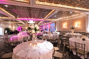 east ballroom centerpieces with pink lighting