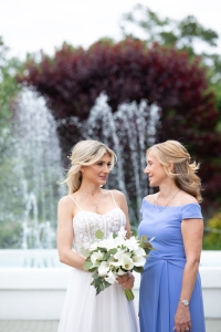 bride talking in front of fountain
