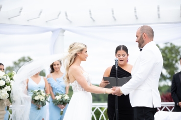 bride and groom holding hands taking vows