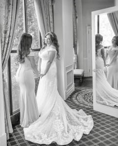 bride in front of window with mirror