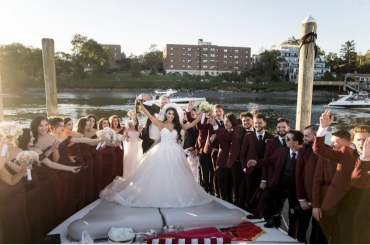 bridal party celebrating on boat
