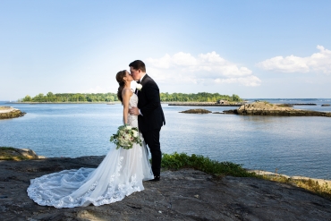 waterfront wedding kiss