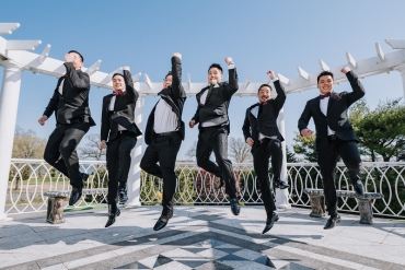 groomsmen jumping in celebration