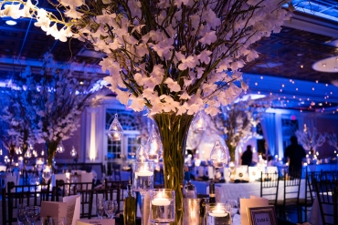 tall flower centerpiece with blue lighting